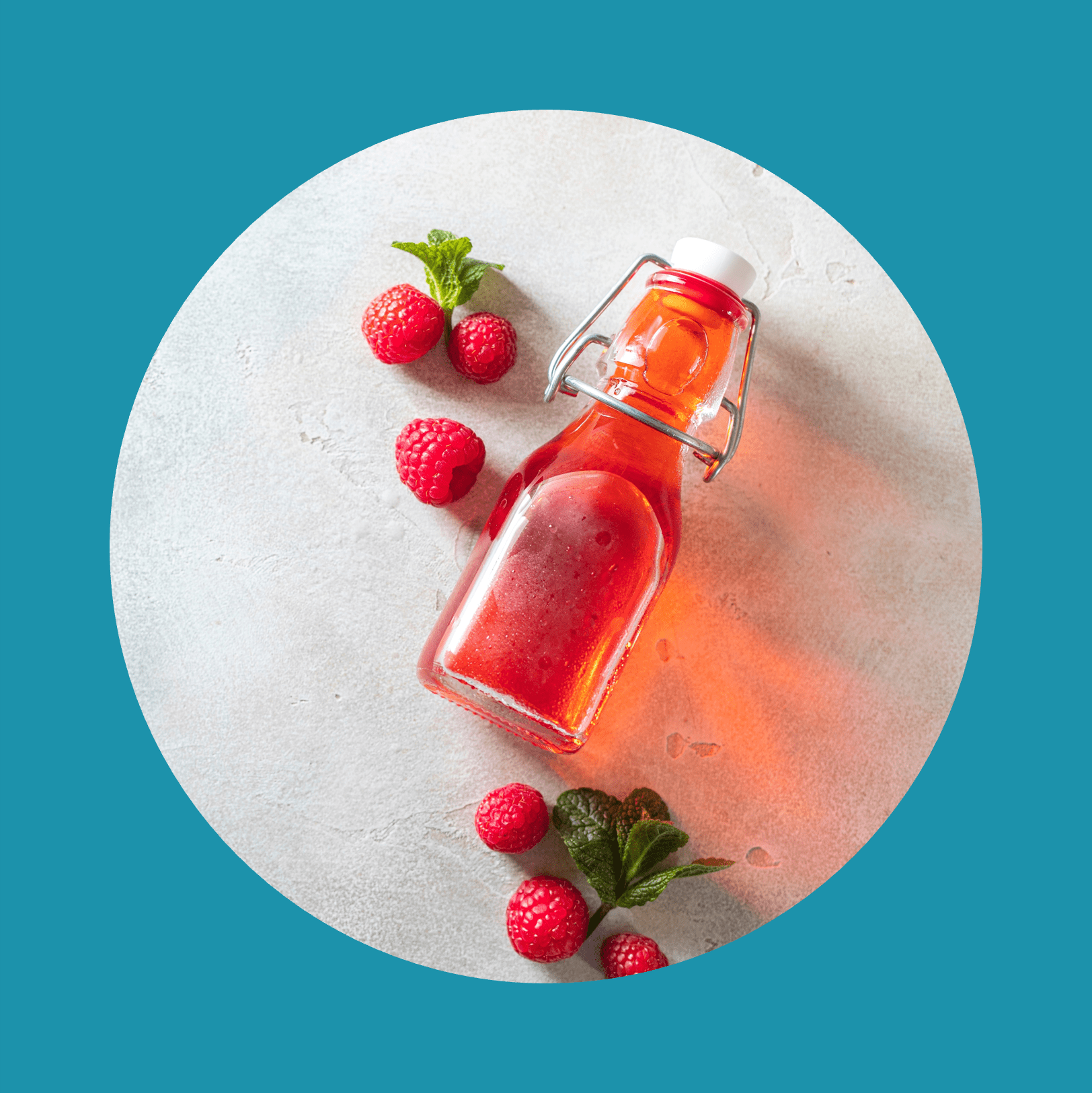 Homemade raspberry vinegar and fresh raspberries.